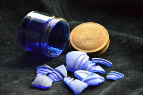 Blue glass usually originates from old Vicks jars and perfume bottles.